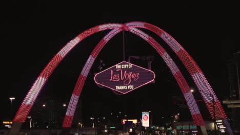 4k-Leaving-Las-Vegas-sign-driving-tracking-down-strip-at-night-neon-lights