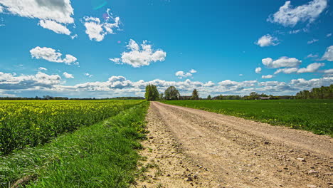 Cloudscape-over-the-countryside-and-dirt-roads-of-rural-Latvia---time-lapse