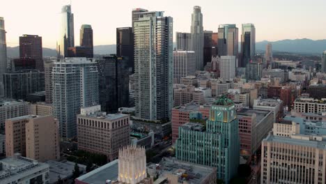 Aerial-View-of-Downtown-Los-Angeles-USA,-Financial-Center,-Skyscrapers-and-Condo-Buildings-at-Sunset,-Cinematic-Drone-Shot