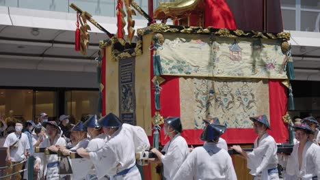 Gion-Festival-Japanese-Men-Push-Heavy-Portable-Shrine-Through-Streets