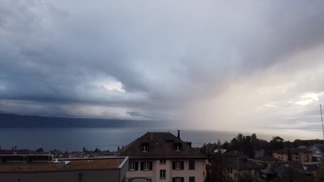 Timelapse-of-the-geneva-lake-with-changing-weather:-a-few-sun-rays-and-at-the-end,-a-cloudy-sky