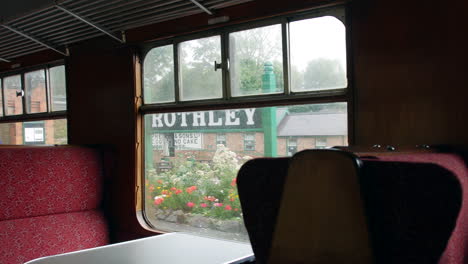 Retro-vintage-train-leaving-the-great-central-railway-station-at-Rothley-in-England