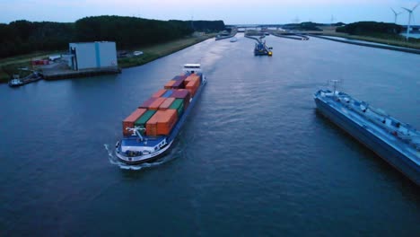 Aerial-View-Over-Amira-Inland-Cargo-Container-Ship-Along-Hollands-Diep-On-Overcast-Moody-Day