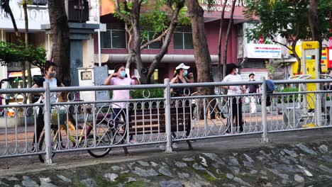 Women-In-Facemask-Dancing-And-Exercising-In-The-Morning-Along-The-Streets-Of-Ho-Chi-Minh-City,-Saigon,-Vietnam