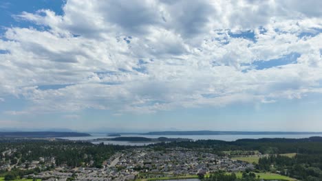 Aerial-hyperlapse-of-clouds-passing-over-Whidbey-Island's-Oak-Harbor-community