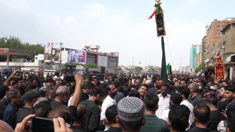 Large-Group-Of-Men-In-Crowd-Chanting-In-Unison-At-Parade-Of-Muharram-In-Karachi