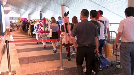Visitors-and-participants-dressed-up-cosplayers-queue-in-line-to-enter-the-Ani-com-and-Games-ACGHK-exhibition-event-in-Hong-Kong