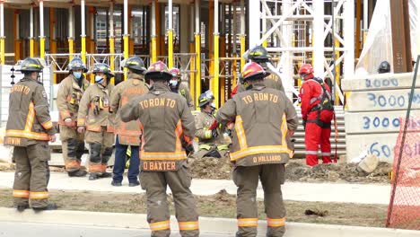 Fire-Fighters-from-Toronto-Watching-a-building-under-construction-at-rescue-operation---still-shot