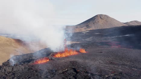 Iceland-2022-volcano-eruption-ejecting-fiery-hot-lava-from-earths-crust,-aerial