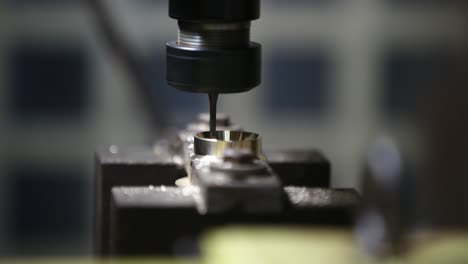 Bronze-on-a-lathe,-processing-and-manufacturing-of-parts-from-brass-on-a-CNC-machine