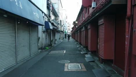 Tokyo,Japan:-slowmotion-pov-moving-into-shopping-street-at-the-Sensoji-japanese-temple-in-Asakusa-area-in-early-morning