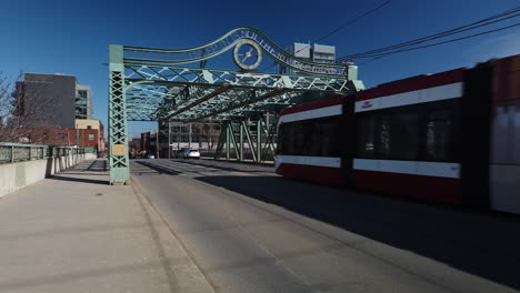 Wide-shot-of-the-Queen-Street-Viaduct-with-pedestrians,-traffic-and-TTC-crossing