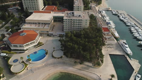 Orbit-Shot-Over-Hotel-And-Spa-Near-Yachts-At-Marina-Lav,-Split-Croatia