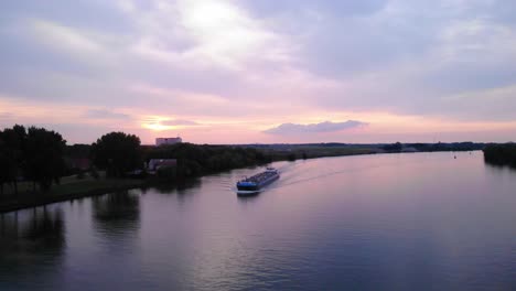 Sunset-Skies-Over-Oude-Maas-With-Inland-Motor-Tanker-Navigating