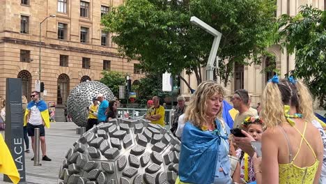 Panning-left-footage-featuring-groups-of-people-from-different-background-gathered-at-Brisbane-Square,-Australia-to-protest-against-inhumane-Special-Military-Operation-carried-out-by-Russia-at-Ukraine