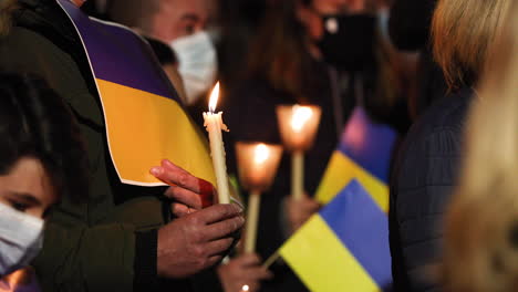 Candles-And-Ukrainian-Flags-At-The-Vigil-For-Peace-In-Ukraine-Held-In-Leiria,-Portugal-At-Night