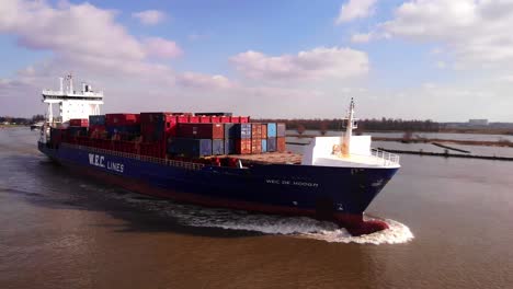 Aerial-View-Of-Forward-Bow-Of-WEC-de-Hoogh-Cargo-Ship-Navigating-Oude-Maas