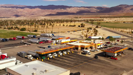 Love's-Travel-Stop-convenience-store-and-gas-station-in-Coachella,-California,-aerial-orbit