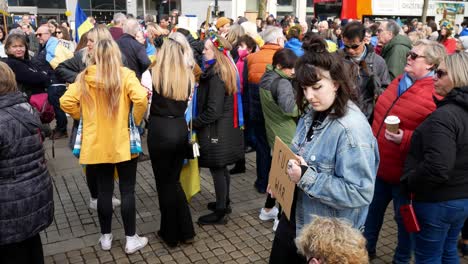 Group-of-people-at-Ukraine-anti-war-protest-activists-meeting-on-Manchester-city-street