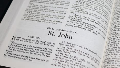 Close-Up-Shot-of-Bible-Page-Turning-to-the-book-of-John