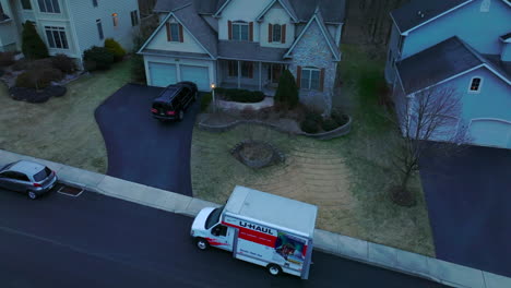 Uhaul-moving-truck-parked-in-suburban-American-neighborhood