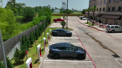 Rising-shot-of-a-Tesla-supercharger-station