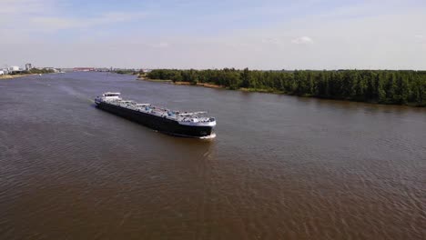 Aerial-View-Of-Minerva-Liquid-Tanker-Ship-Along-Oude-Maas-In-Zwijndrecht