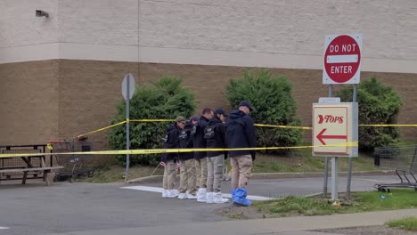 fbi-canvass-standing-outside-the-Mass-race-shooting-in-Buffalo-with-yellow-police-tape