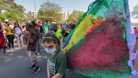 the-tattered-and-bloodstained-brazil-national-flag-at-the-protest-against-the-murders-in-the-amazon-of-brazilian-bruno-pereira-and-brit-dom-phillips