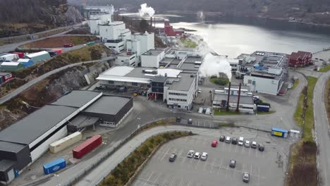 GE-Healthcare-production-facilities-in-Lindesnes-Norway---Ascending-aerial-revealing-huge-factory-producing-pharmaceuticals-and-medical-testing-and-diagnosis-equipment