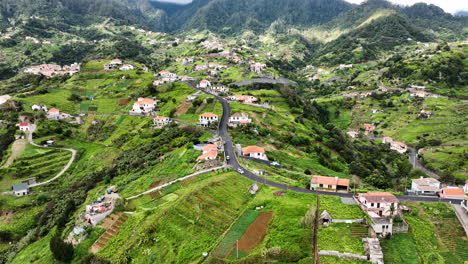 Fertile-farmland-and-scattered-houses-on-dramatic-landscape,-Madeira