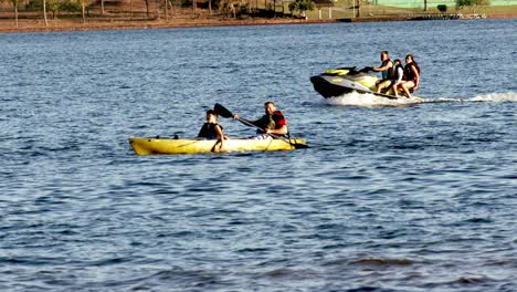 People-enjoying-water-sports-at-Lake-Paranoa-in-Brasilia,-Brazil---slow-motion