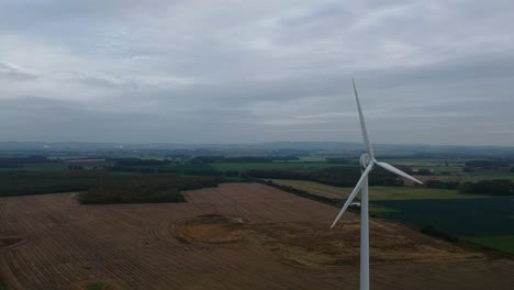 Aerial-rotation-around-wind-turbine-in-British-countryside