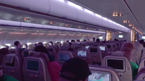 Night-Interior-of-Commercial-Airplane-with-passengers-on-seats
