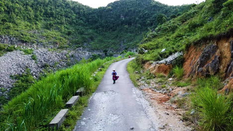High-view-of-a-Vietnamese-local-walking-along-an-old-road-on-the-Ma-Pi-Leng-Pass