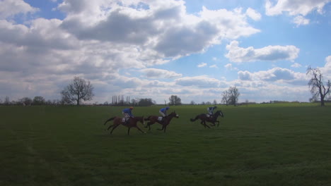 horse-racing-at-p2p-in-Yorkshire-with-horses-galloping-towards-the-finish-line-in-a-panning-shot-filmed-in-slow-motion