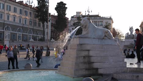 Egyptian-Lion-fountain-of-people’s-square-with-tourists-in-Rome,-Italy