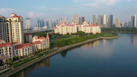 Aerial-drone-shot-of-Costa-Rhu-with-Singapore-skyline-backdrop