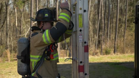 Firefighter-sets-up-a-ladder-as-he-responds-to-an-emergency