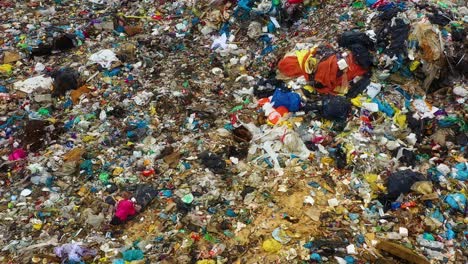 Drone-view-moving-above-garbage-dump-with-tone-of-plastic
