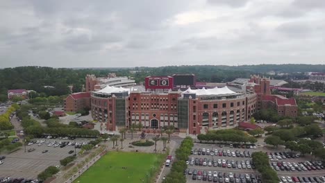 Aerial-pan-of-Doak-Campbell-Stadium-at-Florida-State-in-Tallahassee-on-overcast-day,-orbit