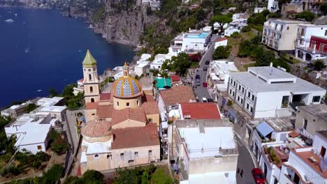 Church-of-Saint-Januarius-in-Vettica-Maggiore-on-the-Cinque-Terre-coastline,-Aerial-drone-flyover-reveal-shot