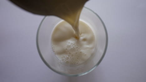 Full-Cream-Milk-Poured-Into-A-Drinking-Glass