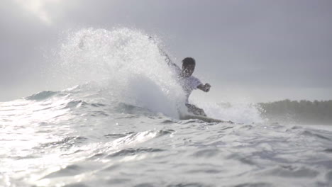 Asian-Filipino-Surfers-Enjoying-Small-Waves-In-Gloomy-Weather