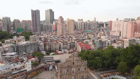 Aerial-view-flying-forward-over-Ruins-of-Saint-Paul's-to-reveal-Macau-cityscape