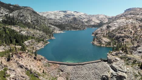Aerial-shot-of-a-large-dam-in-California's-Relief-Reservoir-near-Kennedy-Meadows
