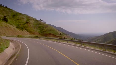View-from-a-vehicle-moving-on-the-curvaceous-mountain-roads-amidst-beautiful-mountains-and-valley