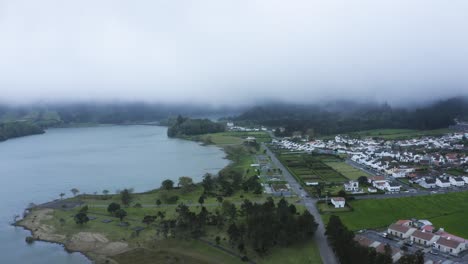 Aerial-establishing-shot-of-Lagoa-Verde-and-nearby-village-in-the-Azores