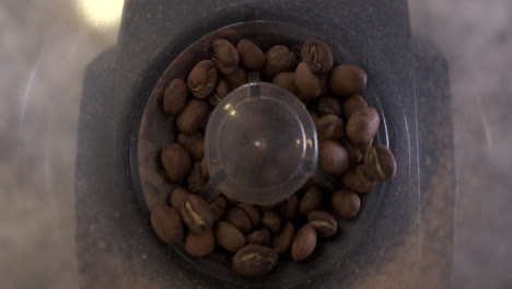 Coffee-beans-being-ground-in-burr-grinder