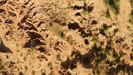 Aerial-shot-of-the-Tatacoa-Desert-during-midday,-turning-Clockwise